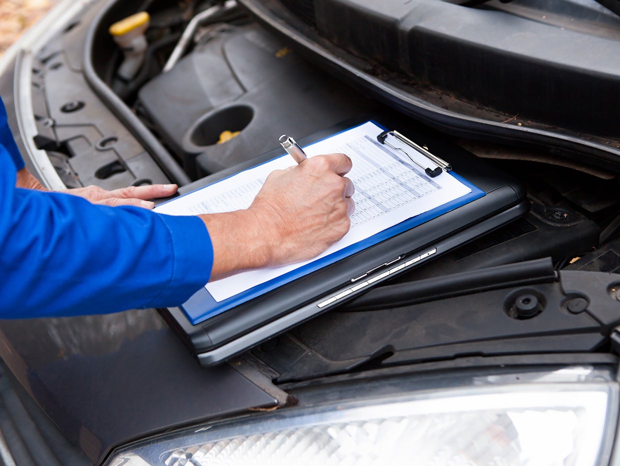 Mazda technician performing engine diagnostics
